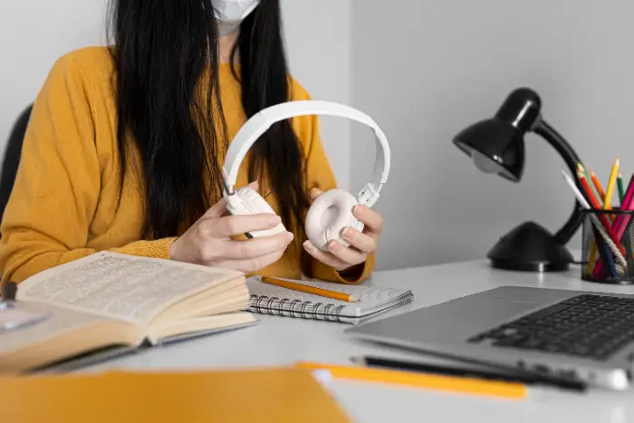 close-up-hands-holding-headphones